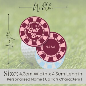 May include: Two round golf ball markers with a pink and burgundy design. The top marker says "In My Golf Era" and the bottom marker says "NAME". The markers are 4.3 cm wide and 4.3 cm long.