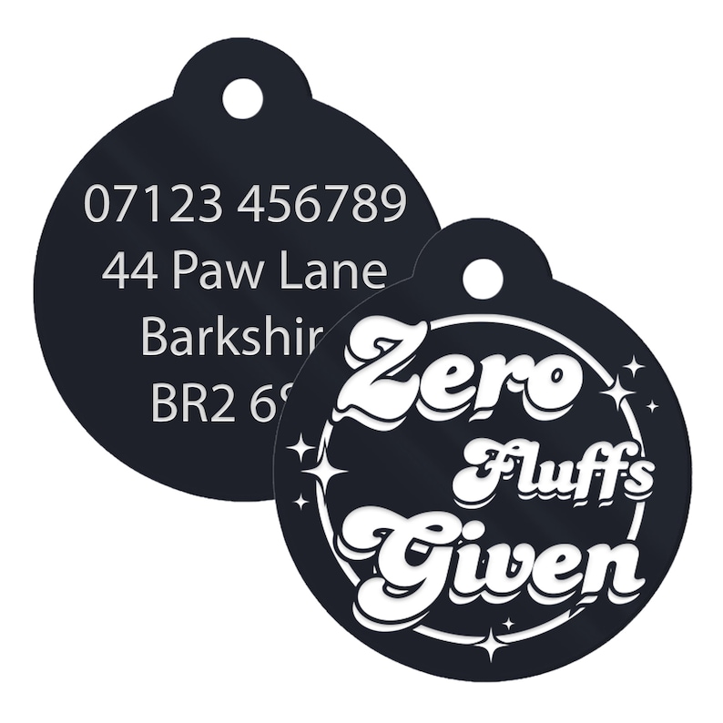 May include: Black and white round dog tag with a phone number, address, and the text "Zero Fluffs Given" in a retro font.