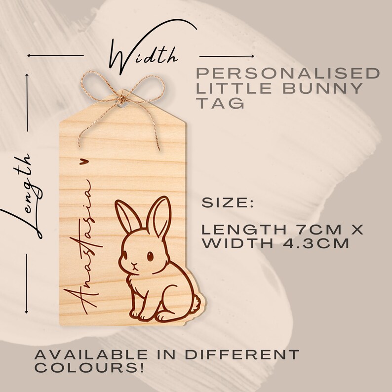 May include: A wooden tag with a bunny illustration and the text "Anastasia" engraved on it. The tag is 7 inches long and 4.3 inches wide. It is available in different colors.
