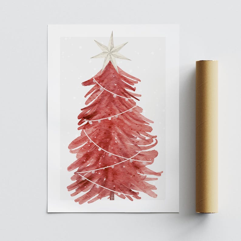 May include: Watercolor print of a red Christmas tree with a white star on top and string lights. The tree is on a white background with a light dusting of snow. A rolled-up poster is to the right.
