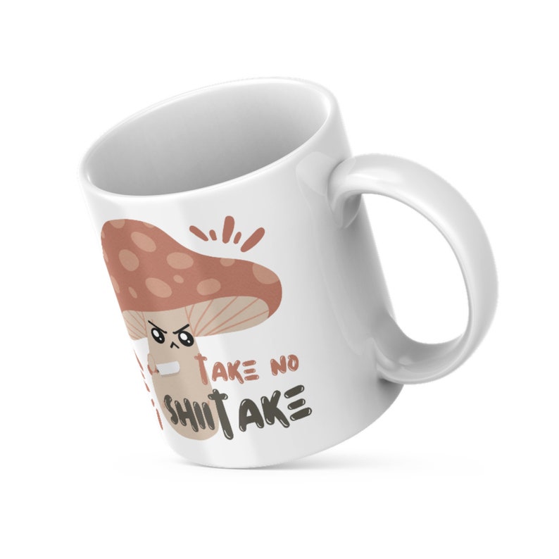 May include: White ceramic mug with a brown mushroom illustration and the text "Take no Shitake".
