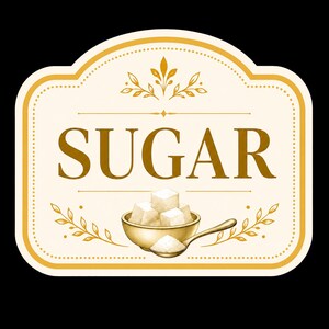 May include: A rectangular label with rounded corners featuring a cream background and gold border. The word SUGAR is printed in large gold letters. Below, a gold bowl holds white sugar cubes, with a gold spoon containing loose sugar in front.