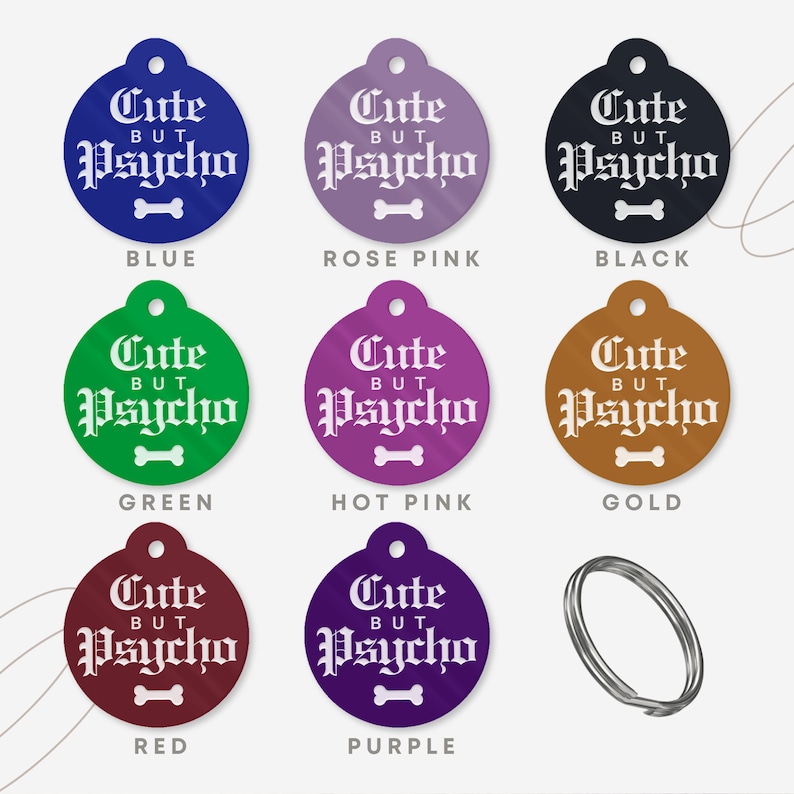 May include: Nine round dog tags in different colors with the text "Cute But Psycho" in white gothic font. The colors are blue, rose pink, black, green, hot pink, gold, red, and purple.