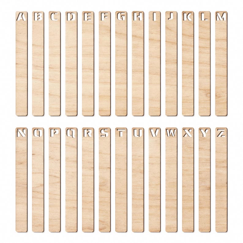 May include: A collection of twenty-six wooden bookmarks, each featuring a different letter of the alphabet. The letters are cut out of the wood, and the bookmarks are arranged in rows. The wood has a light, natural color.