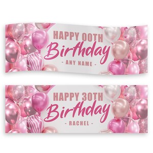 May include: Two birthday banners with pink balloons and the text "HAPPY 00TH BIRTHDAY - ANY NAME -" and "HAPPY 30TH BIRTHDAY - RACHEL -" in pink script. The banners have a white background.