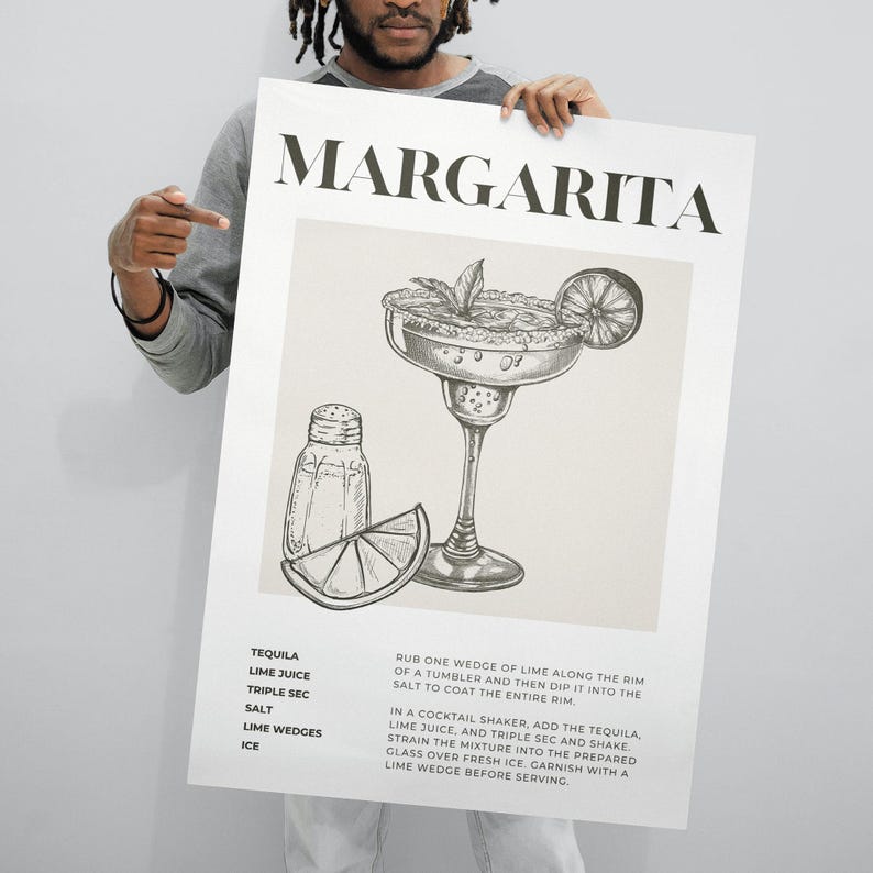 May include: A black and white illustration of a margarita cocktail recipe. The recipe includes tequila, lime juice, triple sec, salt, lime wedges, and ice. The text "MARGARITA" is at the top of the image.