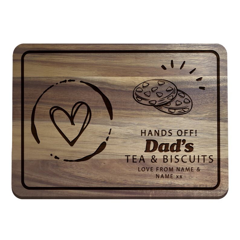 May include: A wooden cutting board with a heart and a cup of tea design. The text reads "Hands Off! Dad's Tea & Biscuits Love from NAME & NAME XX".