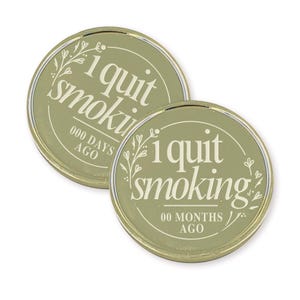 May include: Two gold-colored coins with the text "I quit smoking" and a floral design. The top coin says "000 days ago" and the bottom coin says "00 months ago".