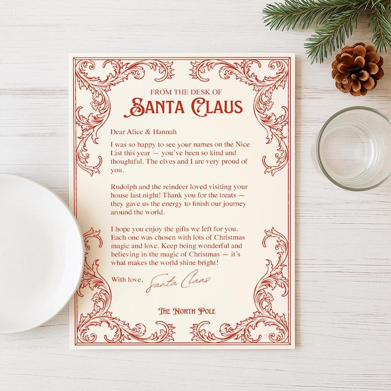 May include: A cream-colored letter from Santa Claus with red decorative borders and text. The letter is addressed to Alice & Hannah and includes a message about being on the Nice List. A pine cone, pine branch, and glass are in the background.