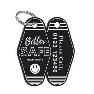May include: Black and white motel key chain with the text "Better Safe Than Sorry" and a smiley face on one side and "Please Call: 0123 123456" on the other side.