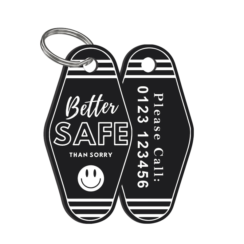 May include: Black and white motel key chain with the text "Better Safe Than Sorry" and a smiley face on one side and "Please Call: 0123 123456" on the other side.