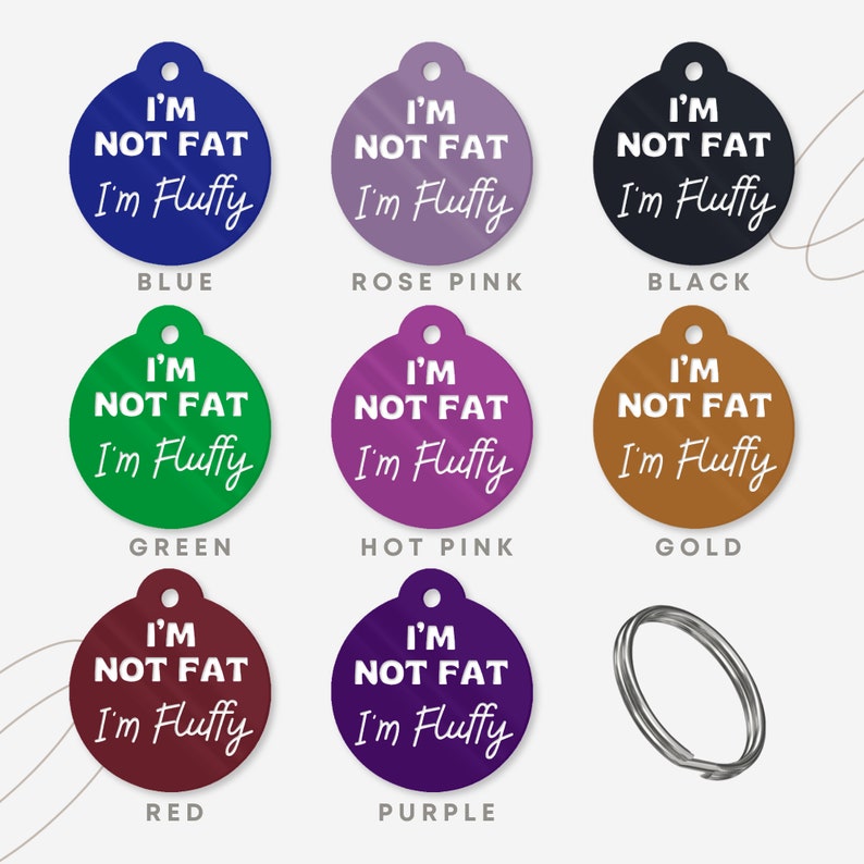 May include: Nine round dog tags in different colors with the text "I'm not fat I'm fluffy" on each tag.