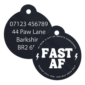 May include: Black round dog tag with white text. The top tag has a phone number, address, and postcode. The bottom tag says "MY MUM IS OUT OF BREATH SOMEWHERE FAST AF PLEASE CALL HER. SHE MAY NEED HELP".