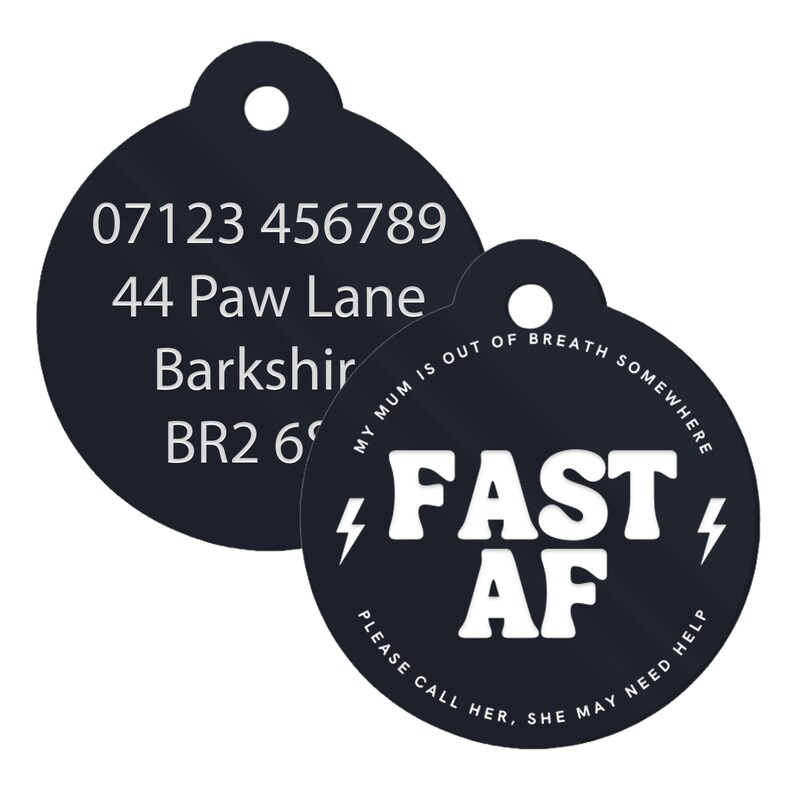 May include: Black round dog tag with white text. The top tag has a phone number, address, and postcode. The bottom tag says "MY MUM IS OUT OF BREATH SOMEWHERE FAST AF PLEASE CALL HER. SHE MAY NEED HELP".