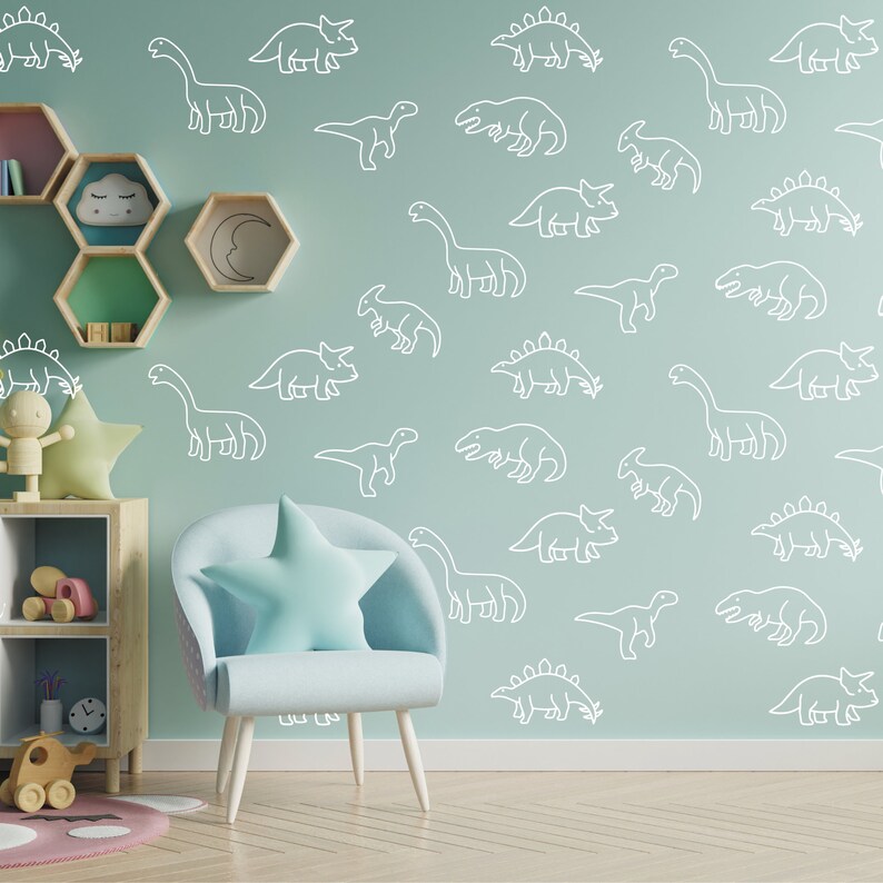May include: A light blue armchair with a white star-shaped pillow in front of a light green wall with a white dinosaur pattern.