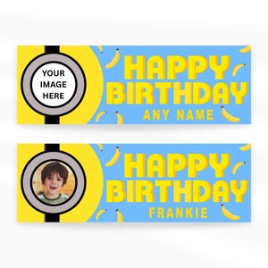 May include: Two birthday banners with a blue background and yellow text that reads "HAPPY BIRTHDAY" and "ANY NAME" or "FRANKIE". The banners have a yellow circle with a space for a photo and banana illustrations.