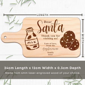 May include: A wooden serving board with a handle, laser-engraved with a milk bottle, cookies, and the words "Dear Santa, Thank you for visiting us!" The board is 9.4 inches long, 4.7 inches wide, and 0.1 inches deep.