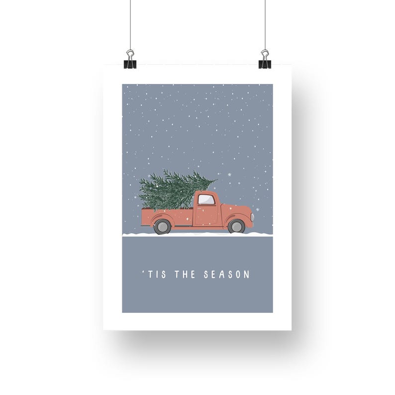 May include: A red pickup truck with a Christmas tree in the back driving through a snowy scene. The text 'Tis the season' is printed below the truck.