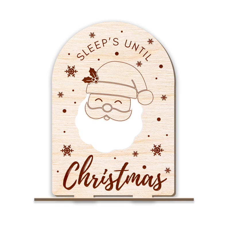 May include: Wooden Christmas countdown sign with a Santa Claus face cutout and the text "Sleep's Until Christmas".