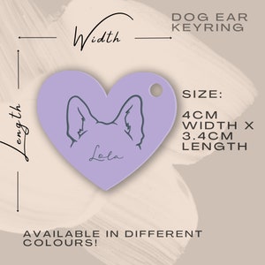 Op de afbeelding: Paarse hartvormige sleutelhanger met een hondenpoot en de naam "Lola" erop gegraveerd. De sleutelhanger is 4 cm breed en 3,4 cm lang.