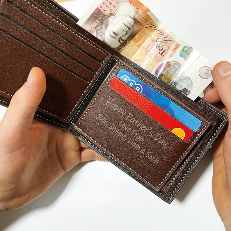 May include: A brown leather wallet with a personalised message inside that reads "Happy Father's Day, Love From Julie, Shayne, Liam & Soph".