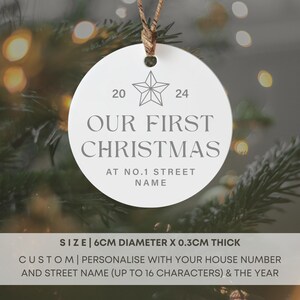May include: White ceramic Christmas ornament with a star design and the text "OUR FIRST CHRISTMAS AT NO.1 STREET NAME". The ornament is 6 inches in diameter and 0.3 inches thick.