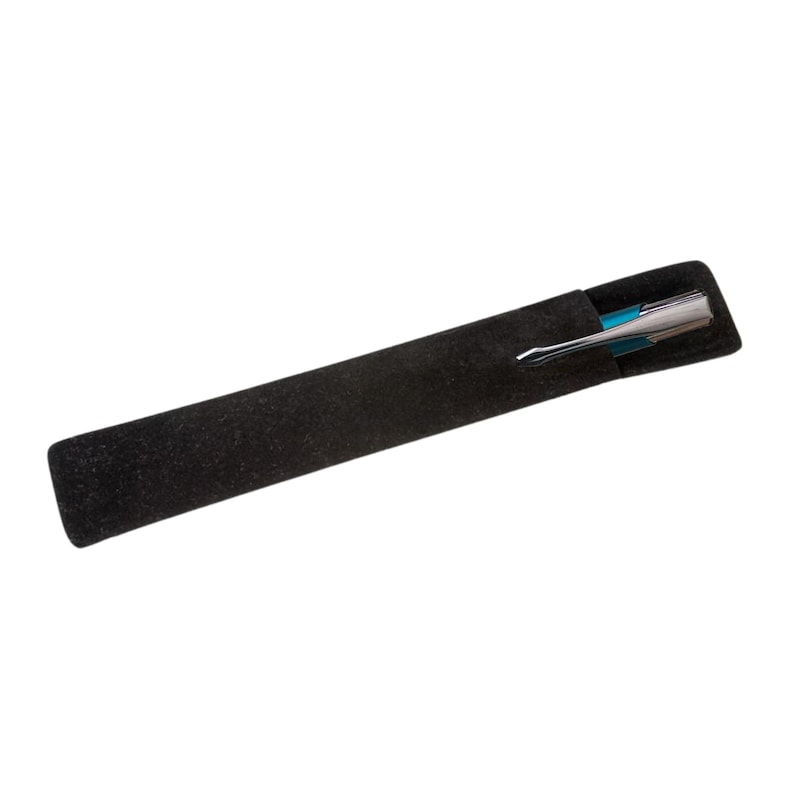 May include: A black velvet pen case with a silver and blue pen inside.