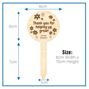 May include: Wooden garden stake with a round, brown sign that says "Thank you for helping us grow! From [Name]" surrounded by small flower designs. The stake is 13 cm tall and 6 cm wide.