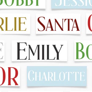 May include: Rectangular white signs with names in various colors. The names include "SANTA", "EMILY", "CHARLIE", and "CHARLOTTE". The text is in a serif font. The background is white.