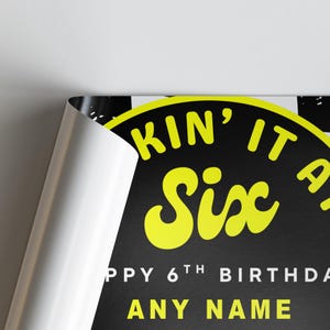 May include: A black and yellow birthday poster with the words "KIN' IT A Six" in yellow, and "HAPPY 6TH BIRTHDAY" and "ANY NAME" in white. The poster has a black and white checkered border.