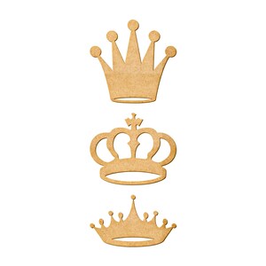 May include: Three wooden crown cutouts in varying designs. The crowns are light brown and feature different styles, including a classic five-point crown, a crown with a cross, and a smaller crown with multiple points.
