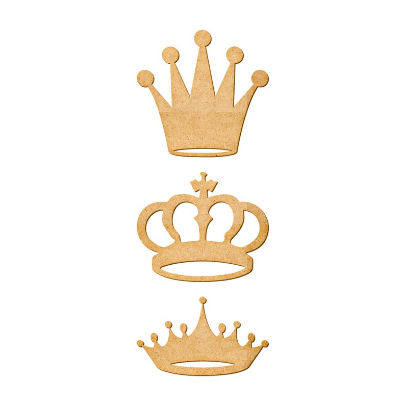 May include: Three wooden crown cutouts in varying designs. The crowns are light brown and feature different styles, including a classic five-point crown, a crown with a cross, and a smaller crown with multiple points.