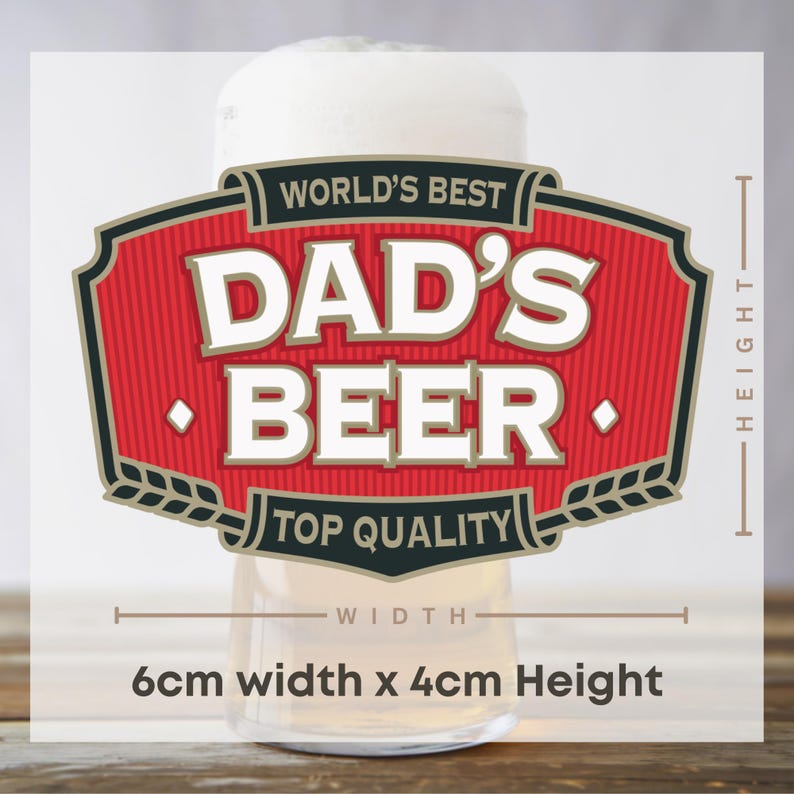 May include: A beer glass with a white foamy head, featuring a red and black label that reads "WORLD'S BEST DAD'S BEER TOP QUALITY". The label is 6cm wide and 4cm high.
