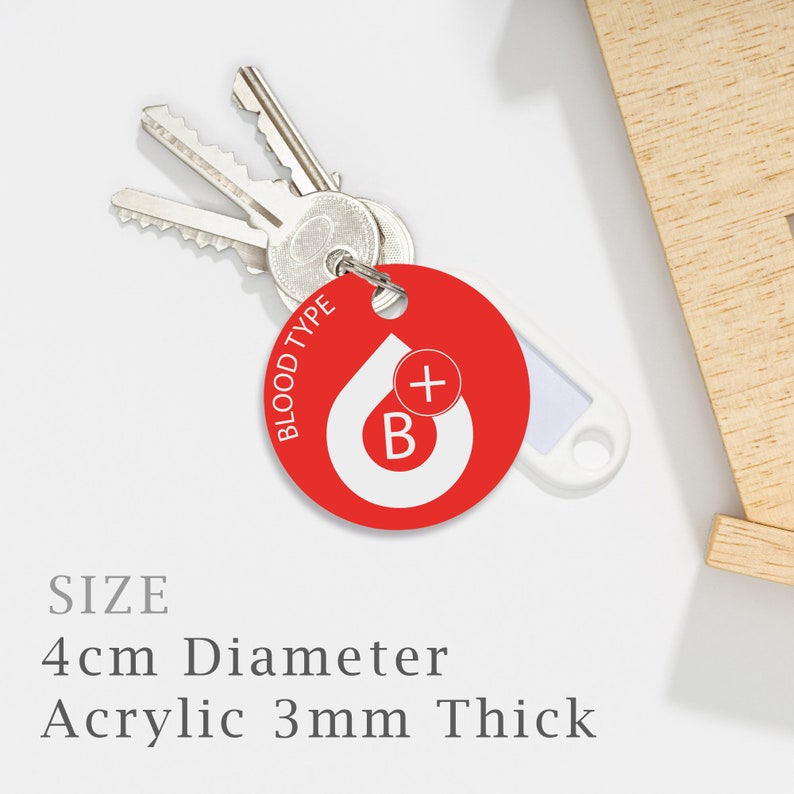 May include: Red round acrylic keychain with a white blood drop and a plus sign inside. The keychain says "BLOOD TYPE B+" around the edge. The keychain is 4 cm in diameter and 3 mm thick.