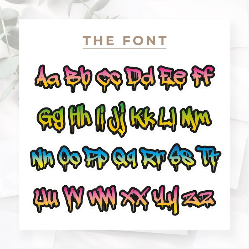 May include: A white background features the text "THE FONT" above a colorful alphabet. Each letter is outlined in black with a graffiti-style design, using a gradient of yellow, green, pink, and blue.