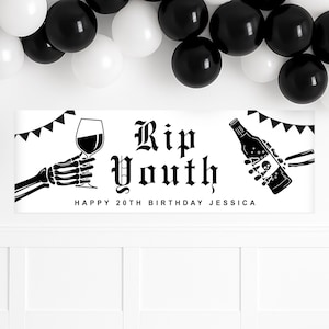 May include: A white banner with black text reading "Rip Youth" and "Happy 20th Birthday Jessica." The banner features skeleton hands holding a wine glass and a bottle. Black and white balloons are in the background.