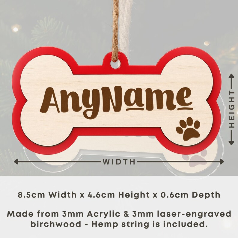 May include: A personalized dog bone-shaped ornament with a red border and a light wood center. The text "AnyName" is displayed in brown, with a paw print. The ornament is 3.3 inches wide and 1.8 inches high.