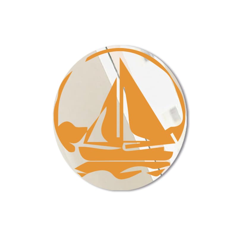 May include: A round, orange mirror with a sailboat design. The sailboat is silhouetted against a white background.