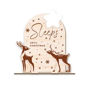 May include: Wooden Christmas countdown sign with two brown deer silhouettes and the text "Sleeps until Christmas".