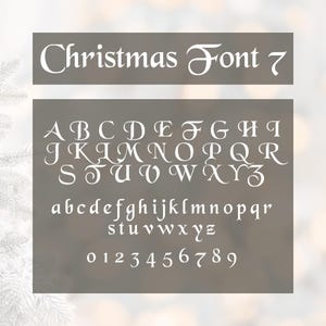 May include: A white Christmas Font 7 alphabet set, including uppercase, lowercase letters, and numbers 0-9. The font has a decorative, elegant style, perfect for holiday-themed designs. The text is displayed on a gray background.