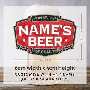 May include: A beer glass with a white foamy head, featuring a red and black label that reads "WORLD'S BEST NAME'S BEER TOP QUALITY". The label is 6cm wide and 4cm high. The text "CUSTOMISE WITH ANY NAME" is also visible.