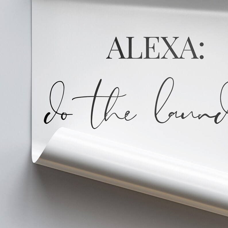 May include: White sign with black text that reads "ALEXA: do the laundry".