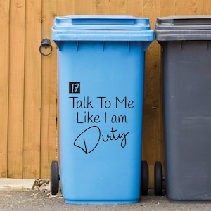 May include: A blue recycling bin with a black sticker that says "Talk To Me Like I Am Dirty".