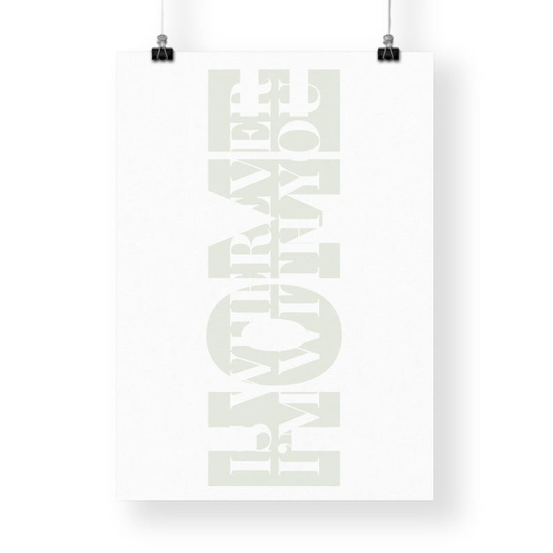 May include: White typography print on a white background. The text reads "HOME IS WHERE THE HEART IS".