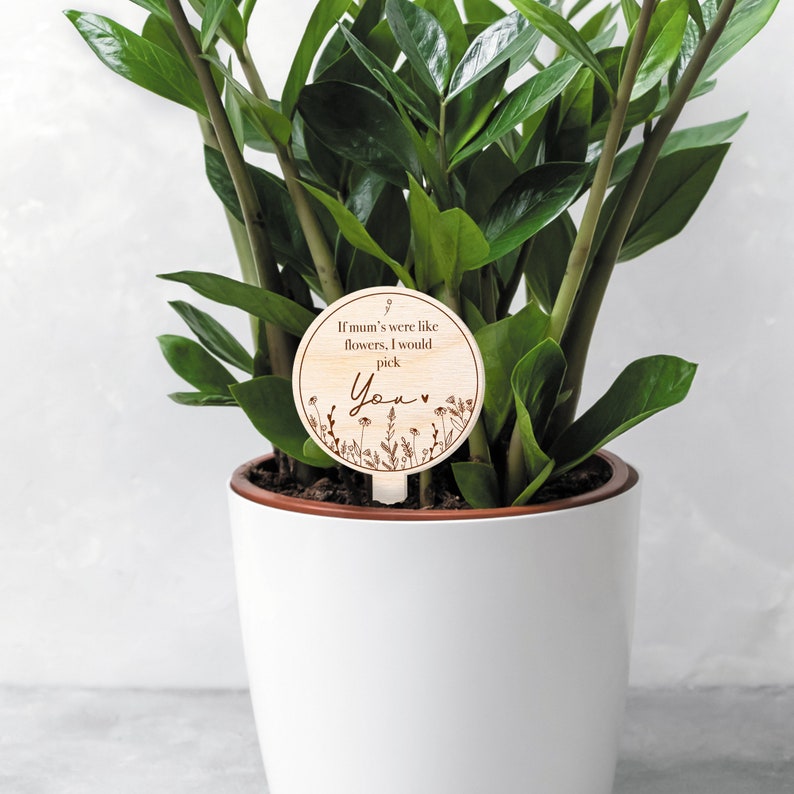 May include: A wooden plant marker with the text "If mum's were like flowers, I would pick You" with a small heart and floral design.