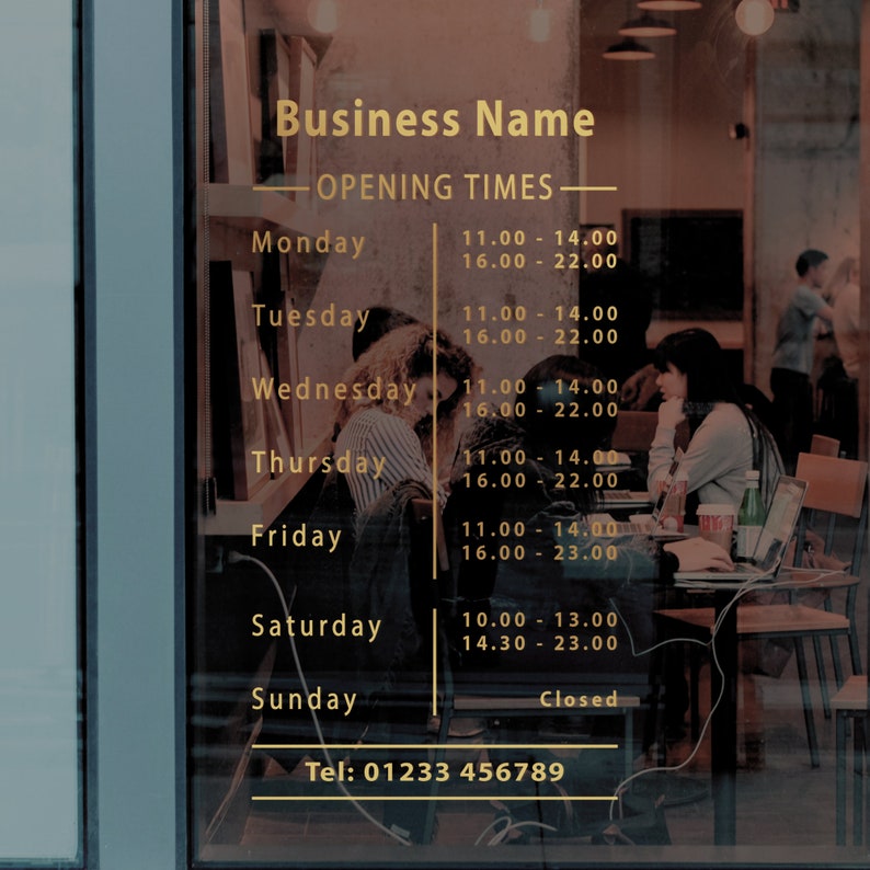 May include: A gold sign with the text "Business Name" and "Opening Times" with the hours of operation listed for each day of the week. The sign is on a glass door with a blurry image of people sitting at tables in the background.