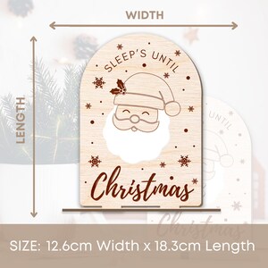 May include: A wooden sign featuring a Santa Claus design and the text "Sleep's Until Christmas". The sign measures 12.6 cm wide and 18.3 cm long.