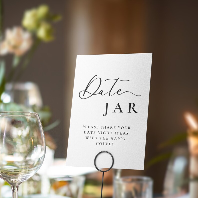 May include: White card with black text that reads "Date JAR" and "Please share your date night ideas with the happy couple".