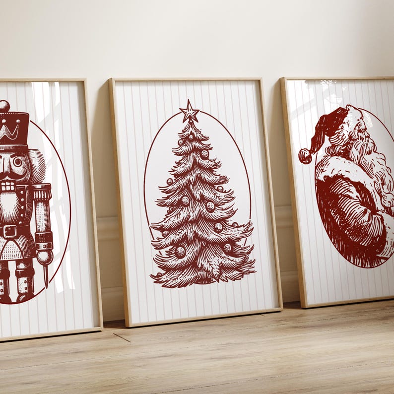 May include: Three framed Christmas-themed prints. The prints feature a nutcracker, a Christmas tree, and Santa Claus, all in a vintage red and white color scheme. The artwork is set against a striped background.
