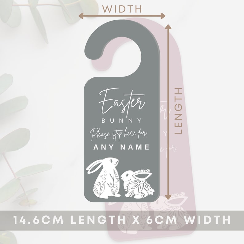 May include: Gray door hanger with a pink bunny rabbit design. The text reads "Easter Bunny Please stop here for [Name]" and measures 14.6 inches long by 6 inches wide.